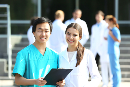 Medical concept - two doctors with stethoscopes and prescription clipboardの写真素材