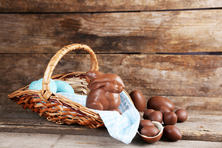 Easter chocolate bunny and eggs on wooden backgroundの写真素材