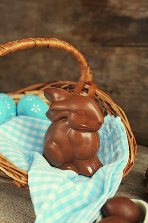 Easter chocolate bunny and eggs on wooden backgroundの写真素材