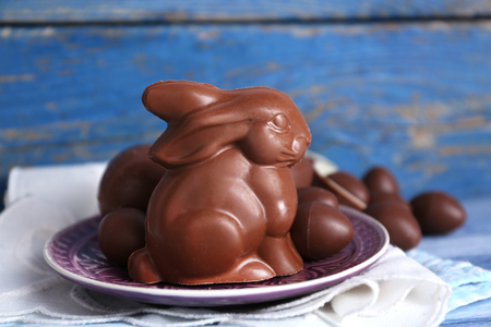 Easter chocolate bunny and eggs on wooden backgroundの写真素材
