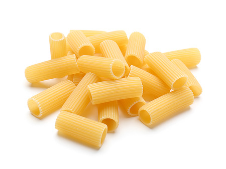 Heap of raw pasta on white backgroundの写真素材