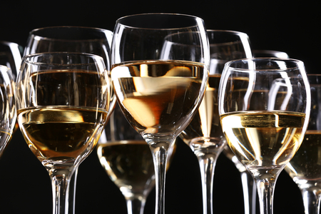 Half full wine glasses on a tableの写真素材