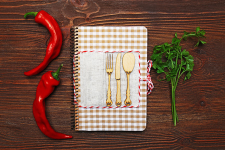 Decorated composition of recipe book and ingredients on wooden backgroundの写真素材