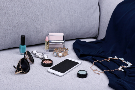 Composition of woman's fashion look on a gray couchの写真素材