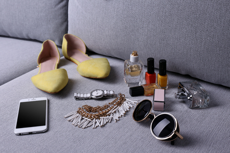 Composition of woman's fashion look on a gray couchの写真素材