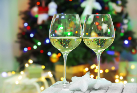 Two champagne glasses on christmas decor backgroundの写真素材