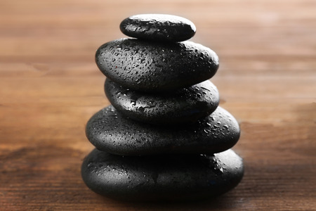 Spa stones on wooden backgroundの写真素材