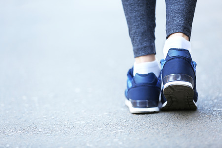 Sports woman legs in running movementの写真素材