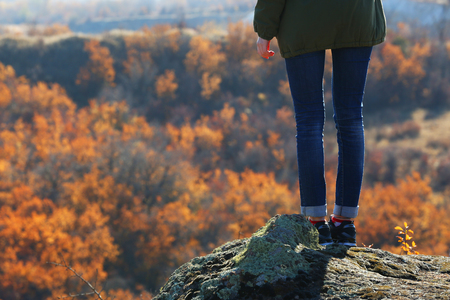 Woman on the top of the mountainの写真素材