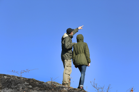 Man and woman on the top of the mountainの写真素材
