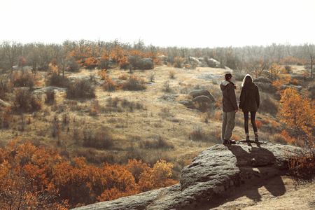Man and woman on the top of the mountainの写真素材