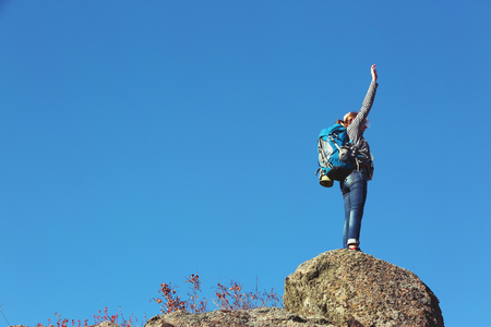 Woman on the top of the mountainの写真素材