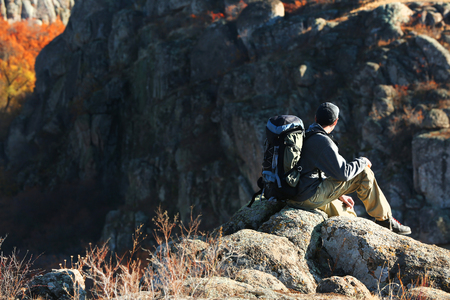 Man sitting on the top of the mountainの写真素材