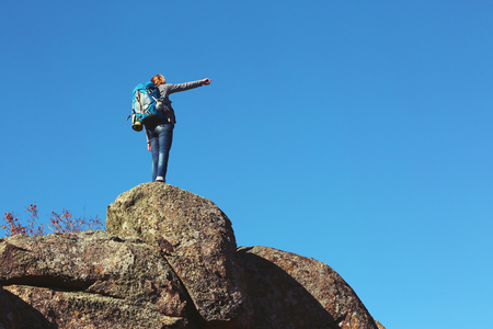 Woman on the top of the mountainの写真素材