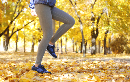 Runner legs outside during autumn day.の写真素材
