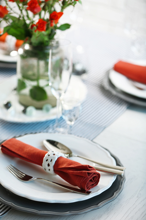 Served table with flowers in restaurant, closeupの写真素材