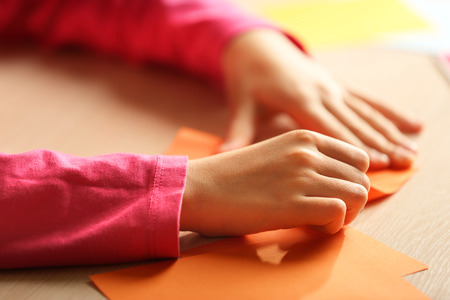 Children making swan with coloured paperの写真素材