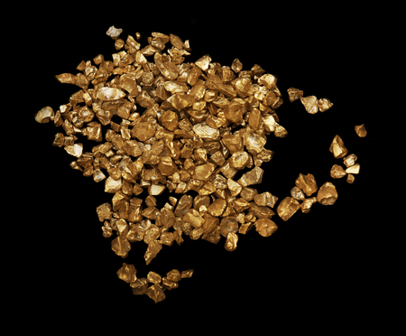 Scattered gold nugget grains, on black background