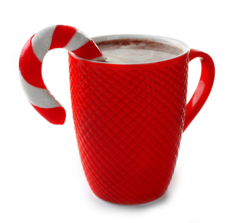 A red cup of cocoa and Christmas candy, isolated on whiteの写真素材