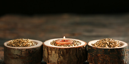 Burning wooden candle with sea salt, closeupの写真素材