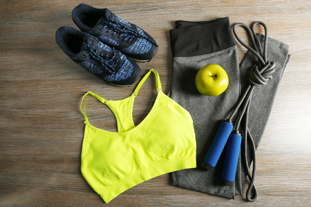 Sport clothes, shoes on wooden backgroundの写真素材