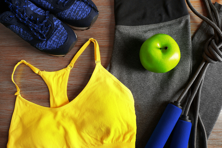 Sport clothes, shoes on wooden backgroundの写真素材