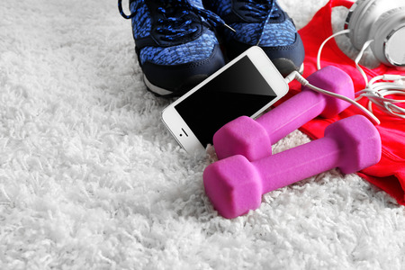 Sport clothes and equipment on white carpet backgroundの写真素材