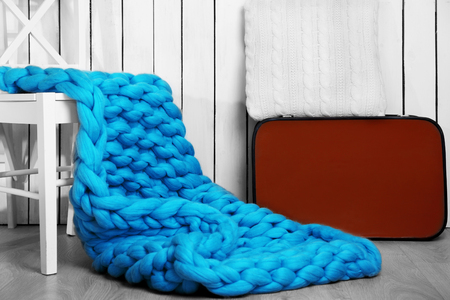Knitted woolen blanket on stairs, on home interior backgroundの写真素材