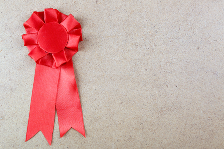 Award ribbon on wooden backgroundの写真素材