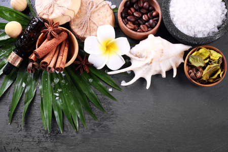 Beautiful spa setting on palm leaf on grey backgroundの写真素材