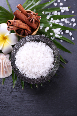 Beautiful spa setting on palm leaf on grey backgroundの写真素材
