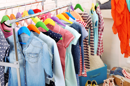 Clothes for kids on hangersの写真素材