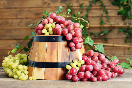Grape and barrel on wooden tableの写真素材
