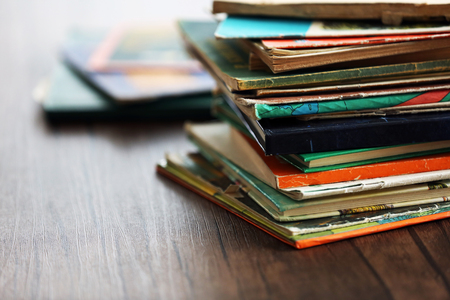 Pile of old books on wooden tableの写真素材