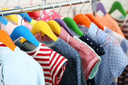 Clothes for kids on hangersの写真素材