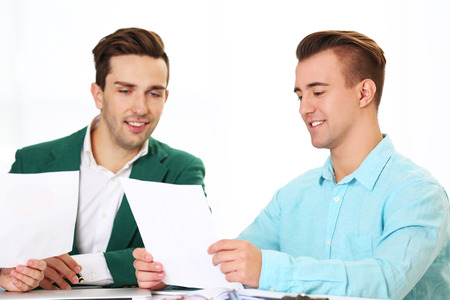 Young business men at the meeting in a conference roomの写真素材