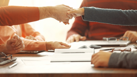 Business people shaking hands after meeting in a conference roomの写真素材