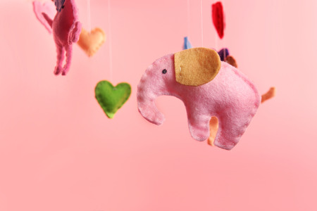 Fleece elephants on pink backgroundの写真素材
