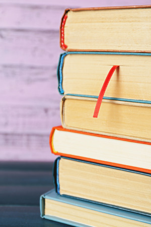 Pile of books on wooden backgroundの写真素材