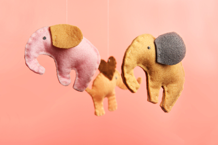Fleece elephants on pink backgroundの写真素材