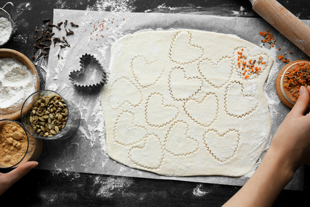 Woman cooking biscuits in kitchenの写真素材