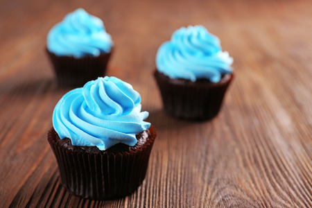 Chocolate cupcakes on wooden backgroundの写真素材