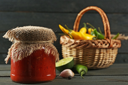 Homemade sauce salsa and spices on  wooden backgroundの写真素材