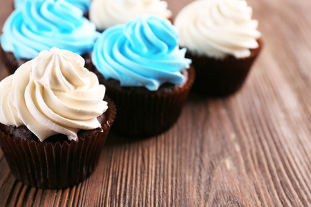 Chocolate cupcakes on wooden backgroundの写真素材