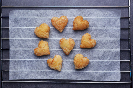 Heart shaped biscuits on a bakery paperの写真素材
