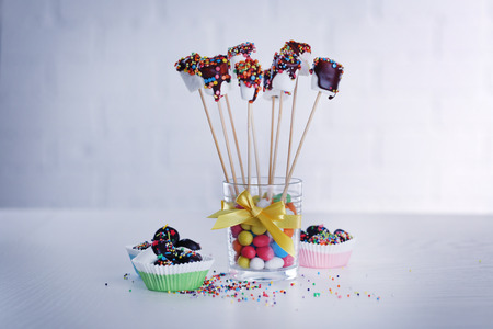 Tasty marshmallows with chocolate on sticks, close upの写真素材