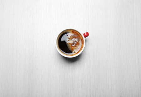 Cup of coffee on light background, top viewの写真素材