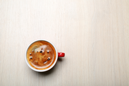 Cup of coffee on light background, top viewの写真素材