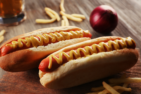 Hot dogs with fried potatoes and onions closeupの写真素材