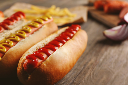 Hot dogs on wooden background closeupの写真素材
